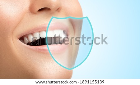 Beautiful female smile. Teeth protected by good hygiene, products and dental care. Royalty-Free Stock Photo #1891155139