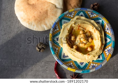 Homemade hummus top view photo. Traditional middle eastern food on a table. Regional food backgrounds. 
