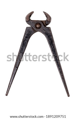 Carpenter tools isolated.  Old open rusty pinching pliers to used for removing nails from wood. Clipping path. Macro of vintage tools.