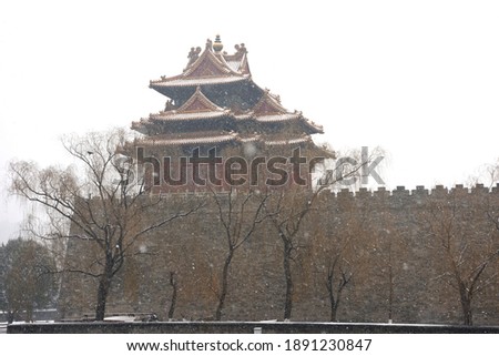 In winter, snow flakes cover the Forbidden City in Beijing, China