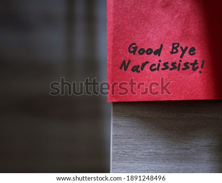 Red sticky note with text written GOOD BYE NARCISSIST , concept of stay away from narcissist ,people who obsess too much in themselves and lack of empathy Royalty-Free Stock Photo #1891248496