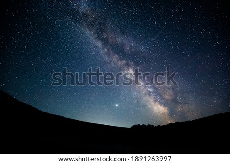Gorgeous night landscape with bright Milky Way. Location place of Carpathian mountains, Ukraine, Europe. Long exposure shot. Picturesque astrophotography. Discover the beauty of earth. Royalty-Free Stock Photo #1891263997