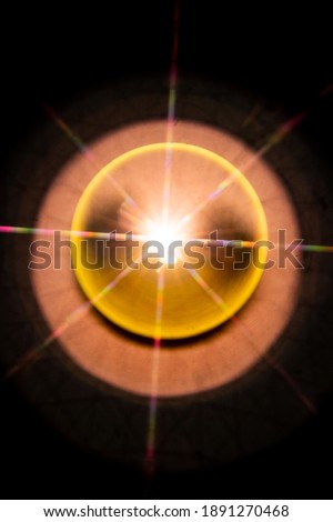 Abstract sun flare. The lens flare is subject to digital correction.