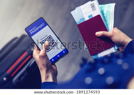 tourist using immunity passport app in mobile phone for travel Royalty-Free Stock Photo #1891274593