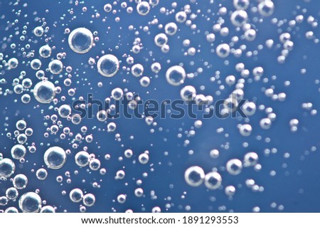 Bubbles from soda water or champagne, beer or other liquid with air, oxygen or carbon dioxide bubbles. Royalty-Free Stock Photo #1891293553