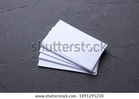 Business card blank on beton rock background. Corporate Stationery, Branding Mock-up. Creative designer desk. Flat lay. Copy space for text. Template for ID.