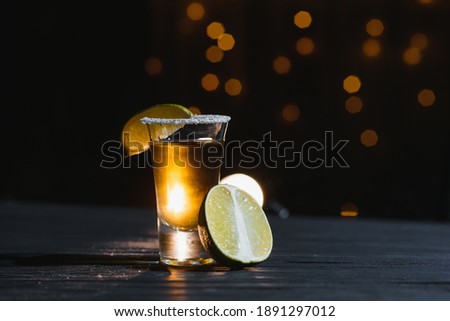 Mexican tequila with lime and salt on rustic wood background. space for text. concept luxury drink. Alcoholic drink concept. Royalty-Free Stock Photo #1891297012