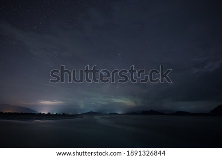 A star at nigh sky with cloudy at night time Royalty-Free Stock Photo #1891326844