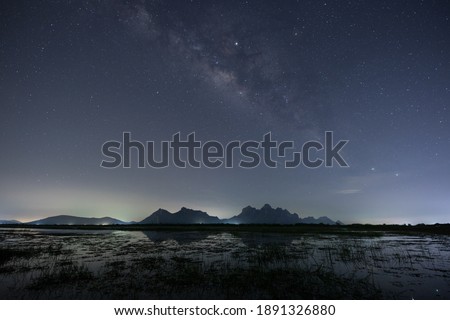 A star at nigh sky with cloudy at night time Royalty-Free Stock Photo #1891326880