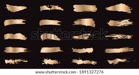 Set of gold ink strokes isolated on black background. Collection of grunge metal paint texture for design. Abstract gold glittering textured illustration. Vector illustration