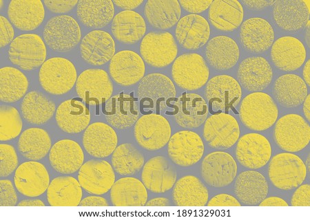 Background pattern of different wine bottle corks, winery texture, food concept and top view. Trendy colors of 2021 - Ultimate Gray and Illuminating