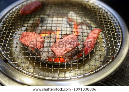 This is a picture of beef grilled over charcoal.