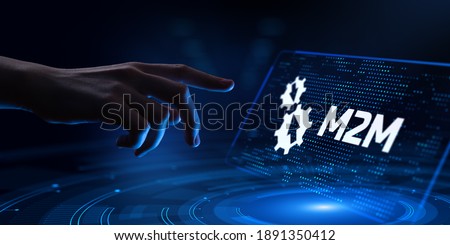 M2M Machine-to-machine technology concept. Hand Pressing button on virtual screen. Royalty-Free Stock Photo #1891350412