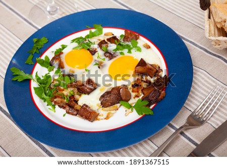 Image of plate with fried eggs with mushrooms and greens, nobody