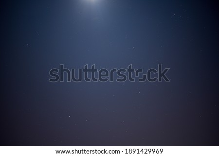 stars in clear sky with moon 