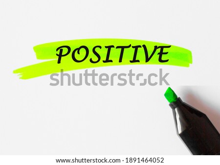 POSITIVE concept write text on paper and highlighted with marker