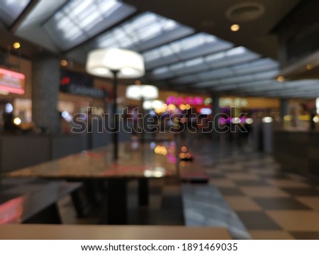 Blur focus of Modern interior of cafeteria or canteen with chairs and tables