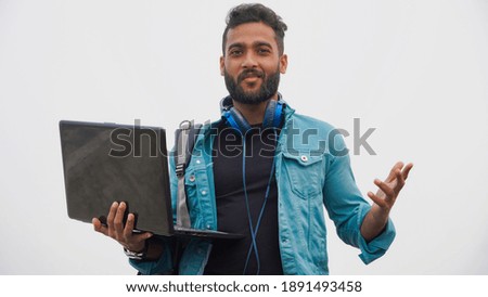 Young man with laptop and headphone