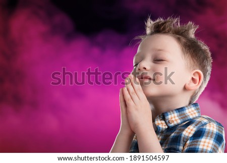 Little toddler boy keep praying for world pandemic coronavirus Covid-19