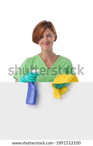 A woman cleaning lady with a rag in her hand holds an air freshener spray. House cleaning concept or office cleaning concept. Blank banner