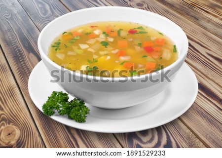Bowl of delicious vegetable soup on a table Royalty-Free Stock Photo #1891529233