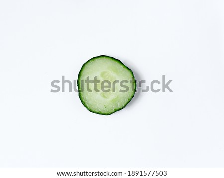 Cucumber on a white background isolated close-up, cucumber slices isolated on a white background