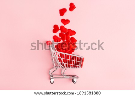 valentine's day pink background, grocery cart and red heart, top view, minimalism Royalty-Free Stock Photo #1891581880