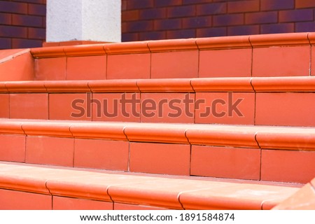 Steps made of brown clinker tiles . Cottage porch
