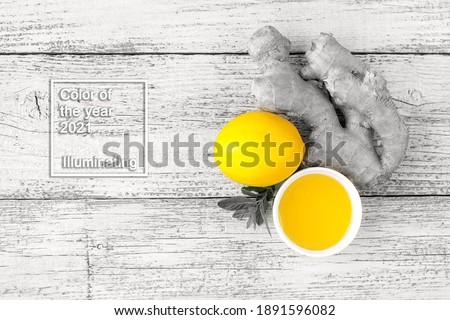 Ginger root lemon mint and honey ingredients for natural hot drink on white wooden background. copy space. Color of the year 2021