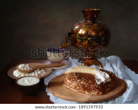 Still life with pancakes and tea from  a samovar