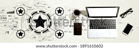 Rating star concept with a laptop computer on a desk