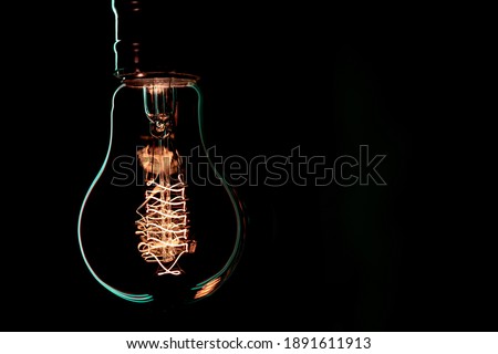 Luminous lamp hang in the dark. Decor and atmosphere concept.