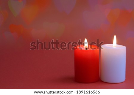 Valentines day banner. Two candel on the red background. Romantic background