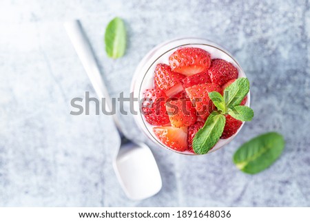 Greek yogurt strawberry and mango parfait in glasses. toning. selective focus