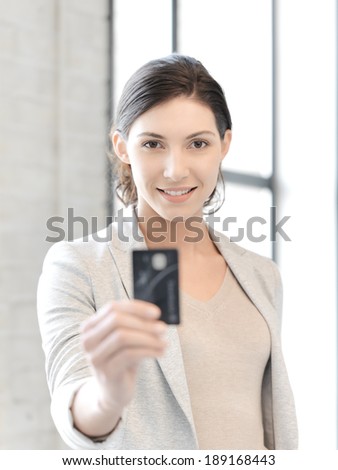business concept - bright picture of happy woman with credit card
