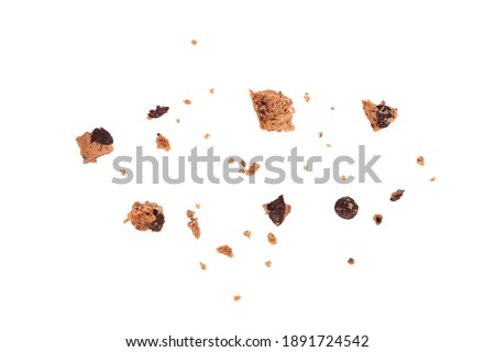 Isolated clipping path of die cut dark chocolate chip cookies piece stack and crumbs on white background of closeup tasty bakery organic homemade American biscuit sweet dessert Royalty-Free Stock Photo #1891724542