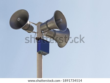 Horn speaker on top of pole                 Royalty-Free Stock Photo #1891734514