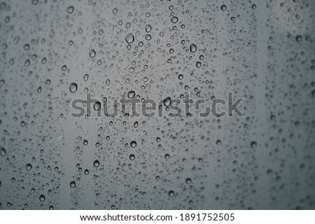Waterdrop on glass. Water droplets on glass background. Royalty high-quality stock photo image of water drops texture abstract. Wet water on glass background. Close up of bubble pattern rain concept