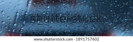 Dripping Condensation, Water Drops Background Rain drop. Close up for misted glass with droplets of water draining down. Blur effect. Soft focus. Abstract background with effect of bokeh.
