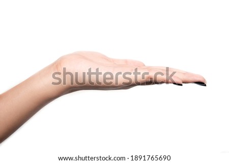 Outstretched open female hand isolated on white background. 