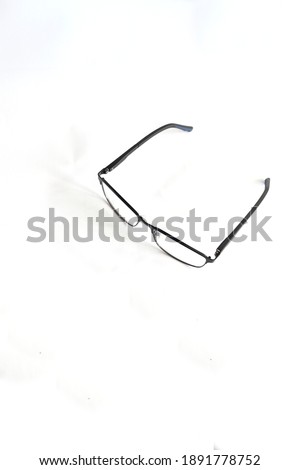 Metal black sports glasses and black handles and rubber on blue handles on a white background and in the photo from the front