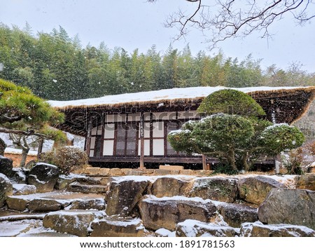 traditional Korean style house on snowy day