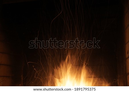 Fire with sparks shooting upward