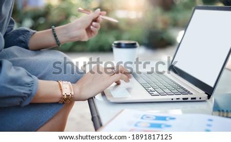 Close up of hand young asian businesswoman working at home on her laptop computer  