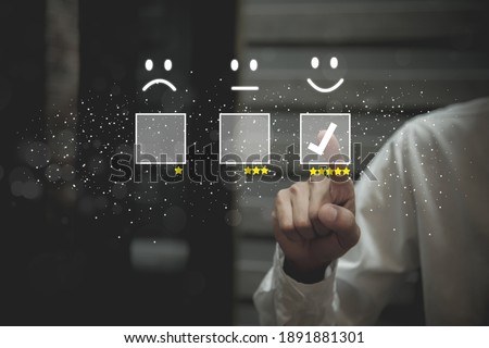 Businessman pressing smiley face emoticon on virtual touch screen. Customer service evaluation   Service rating, satisfaction  concept.