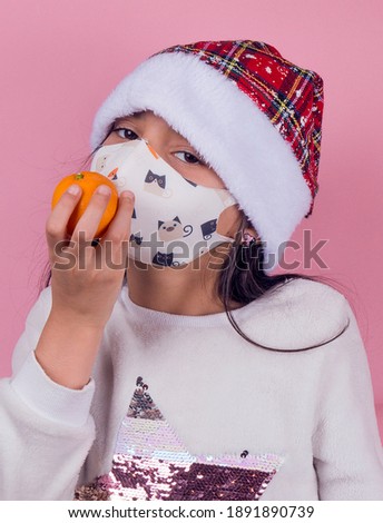 funny girl with mask on pink background