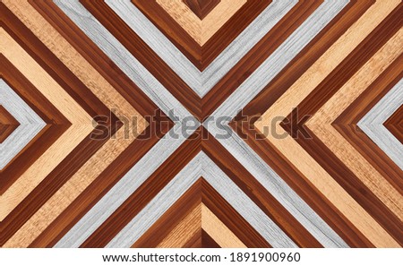 Colorful wooden wall with chevron pattern made of narrow planks. Wood texture background.