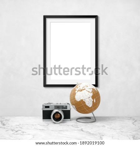 Blank frames mockup with world and old camera