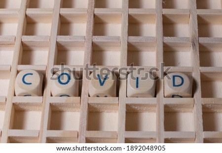 Wooden Letters with Word Covid 
