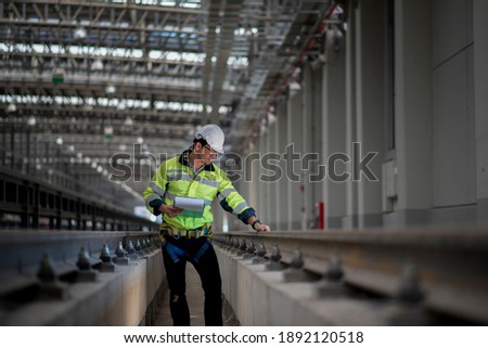 Engineer standing in depot  and railway inspection. construction worker on railways. Engineer work on railway. rail, engineer, Infrastructure Royalty-Free Stock Photo #1892120518